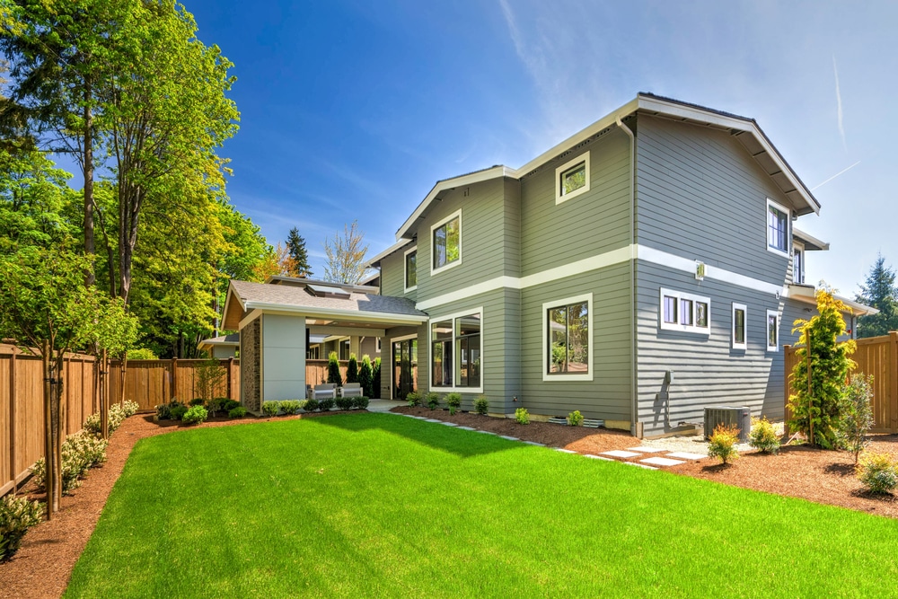 Large,Modern,Grey,New,House,With,Back,Porch,From,Back