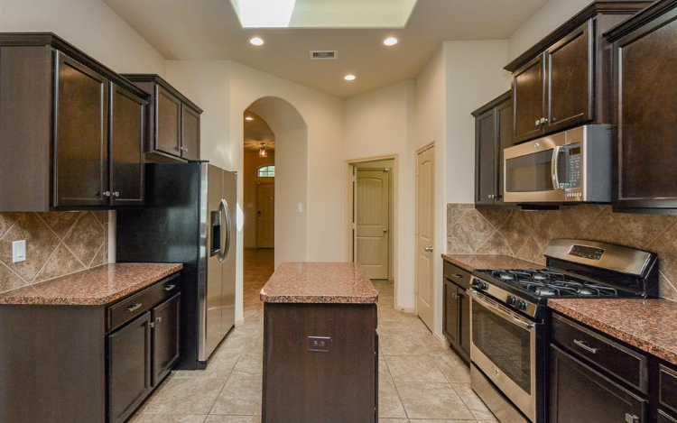 dark-wood-kitchen-cabinets-before-painting-west-houston.jpg