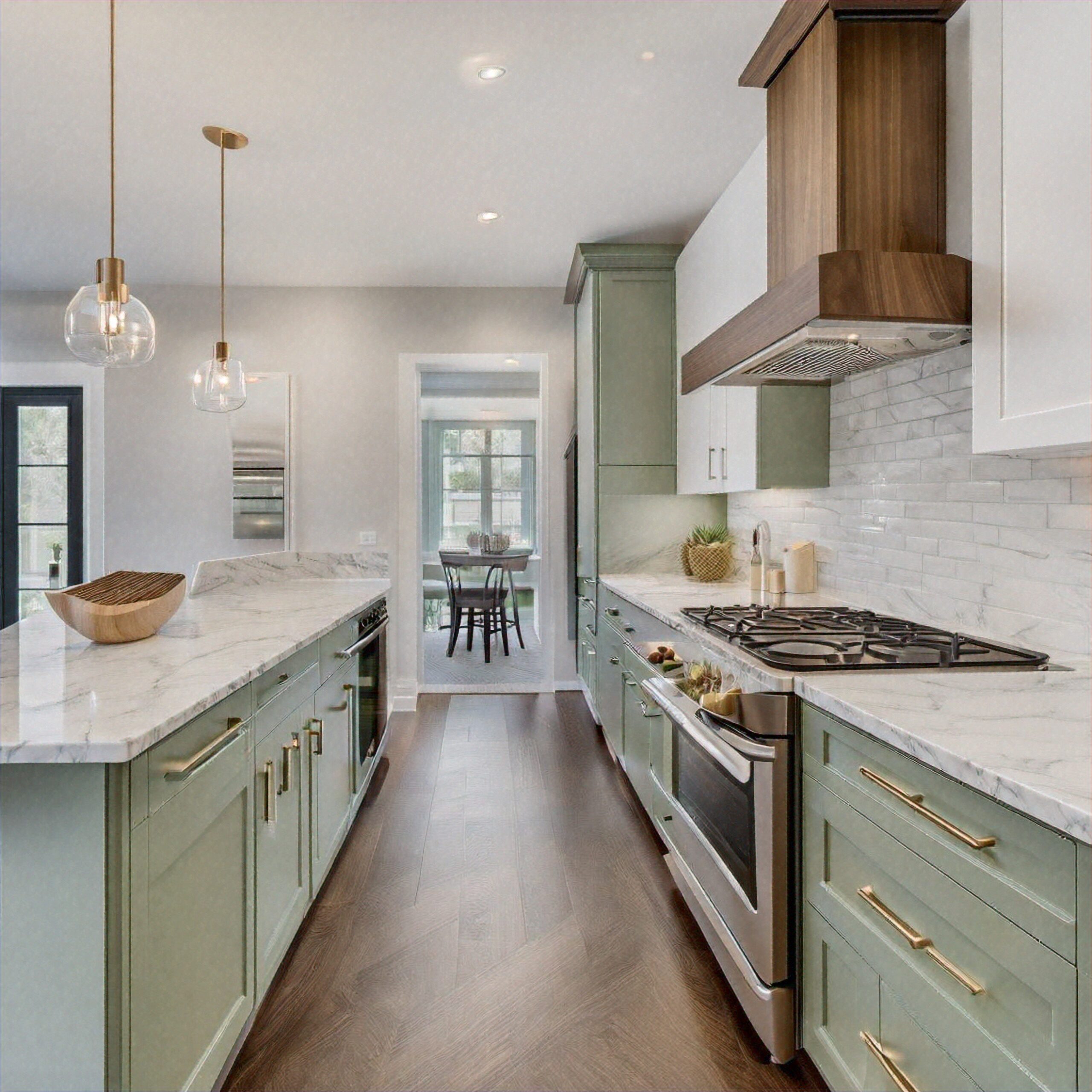 Galley,Kitchen,With,A,Peninsula,That,Has,Sage,Green,Lower